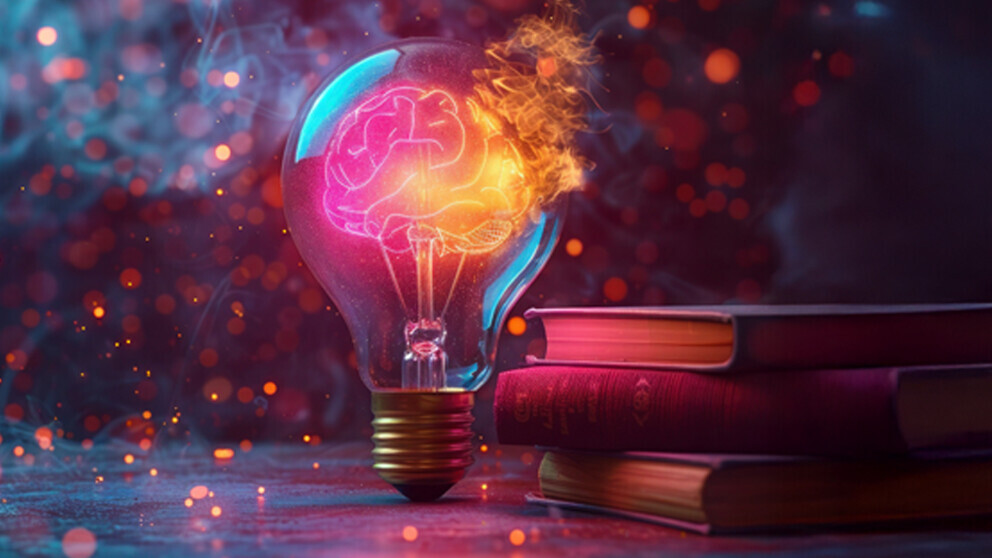 Glühbirne mit stylisiertem Gehirn als Symbol für Forschung und Entwicklung